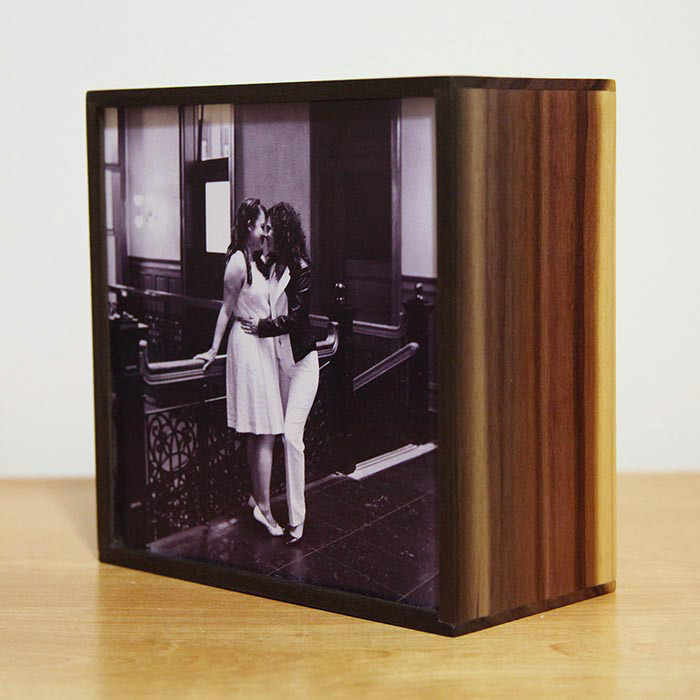 Image of a custom light box of two women embracing