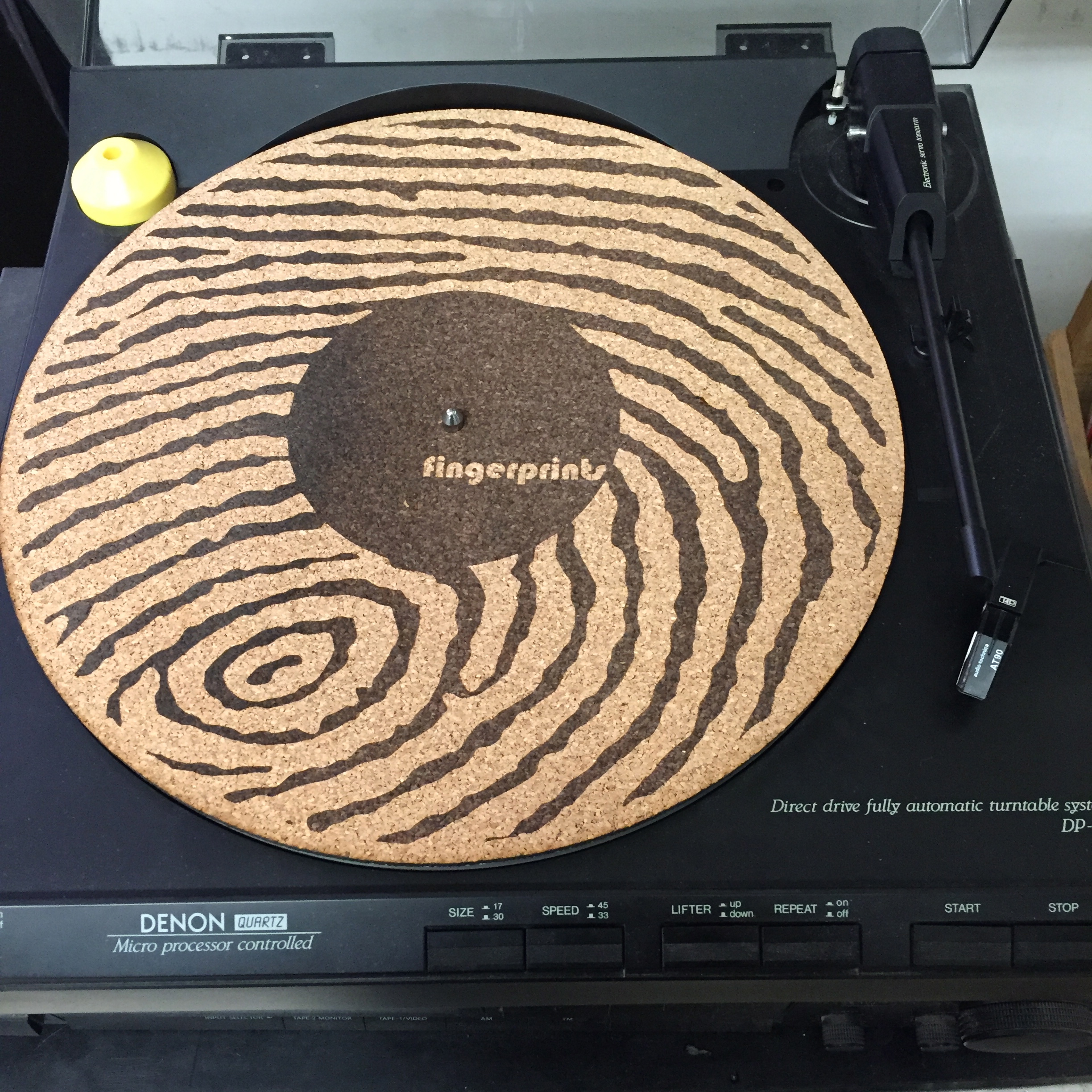 Image of a turntable with the logo of the Long Beach music store Fingerprints